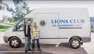 Joe and Ben with the Richmond Lions Club van ready to collect donations for the Op Shop