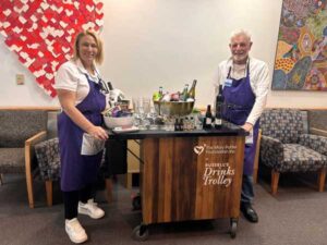 Derek & Jo with drinks trolley - Lions Club of Richmond
